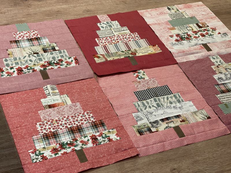 En flott quilt med juletrær og stjernerblokker